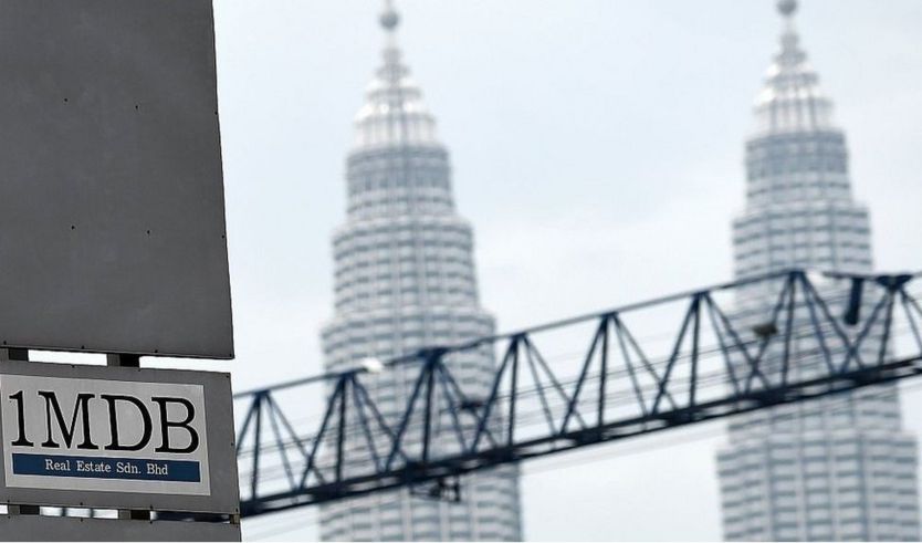 1MBD logo in front of Petronas towers