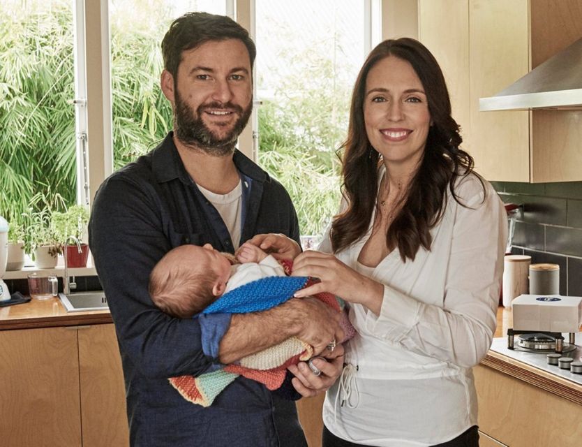 Clarke Gayford holds baby Neve Te Aroha Ardern Gayford alongside Jacinda Ardern