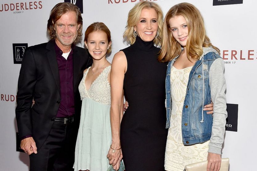William H Macy, Felicity Huffman and the couple's two daughters at a 2014 movie premiere.