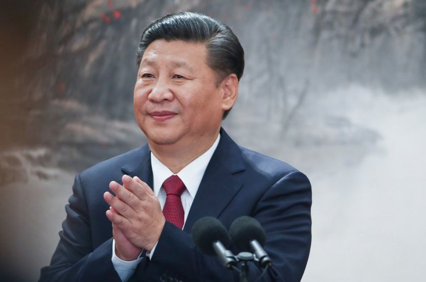 Chinese President Xi Jinping speaks at the podium during the unveiling of the Communist Party