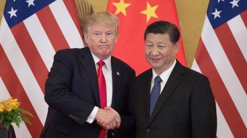 US President Donald Trump shakes hands with China"s President Xi Jinping