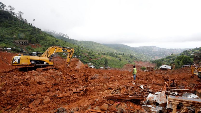 Heavy machines are seen during work at the place of the mudslide in the mountain town of Regent, Sierra Leone August 16, 2017.
