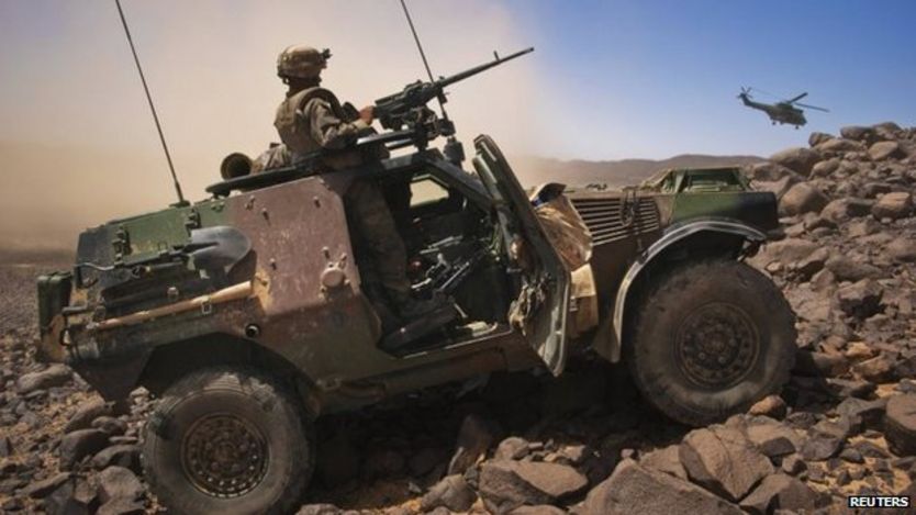 A French soldier stands guard in an armoured vehicle in northern Mali in March 2013.