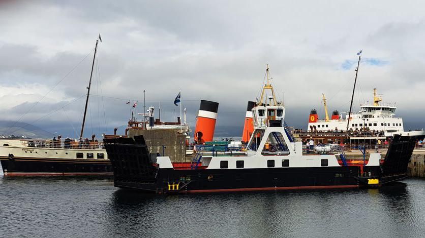 Three ships in harbour