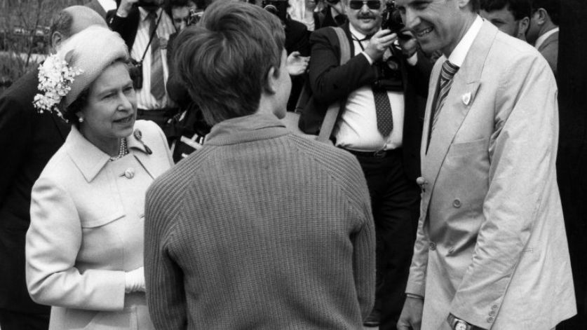 Her Majesty Queen Elizabeth II opens the Festival Garden site in 1984. She is pictured with Blue Peter presenter Simon Groom and Theodore Gayer-Anderson, who won the competition to design the Blue Peter garden there.