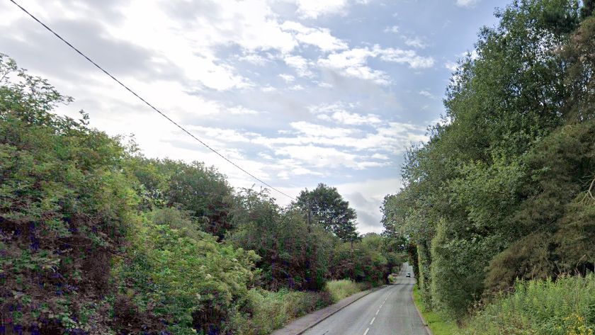 A general view along Rawnsley Road with hedges along both sides of the road