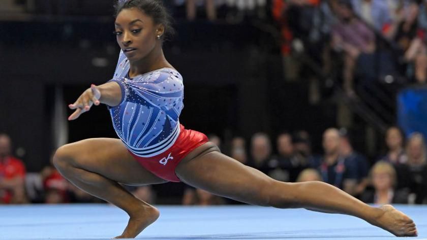 Simone Biles performs on the floor