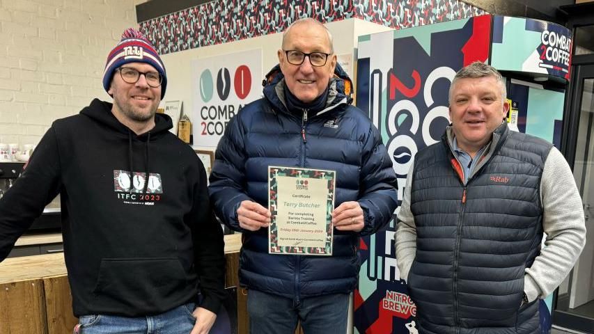 Terry Butcher (centre) with combat2coffee members.