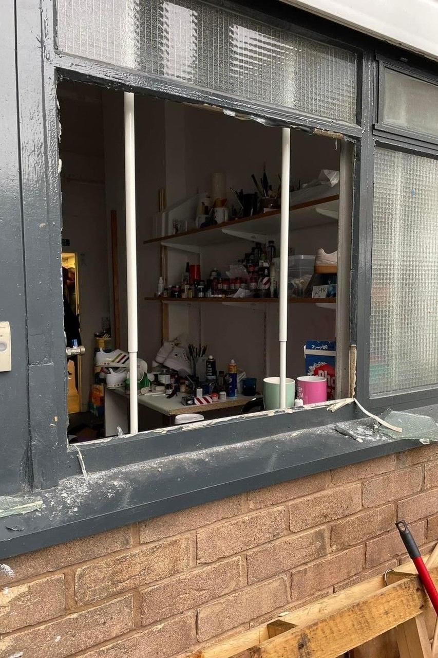 Damaged window at Wrexham Trainer Revival
