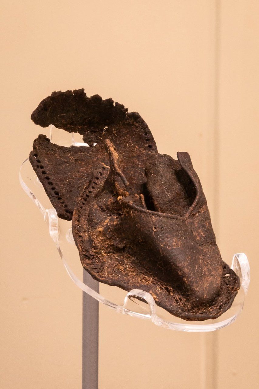 A child's shoe, believed to be from a family forced from their home during the Highland Clearances, is also featured