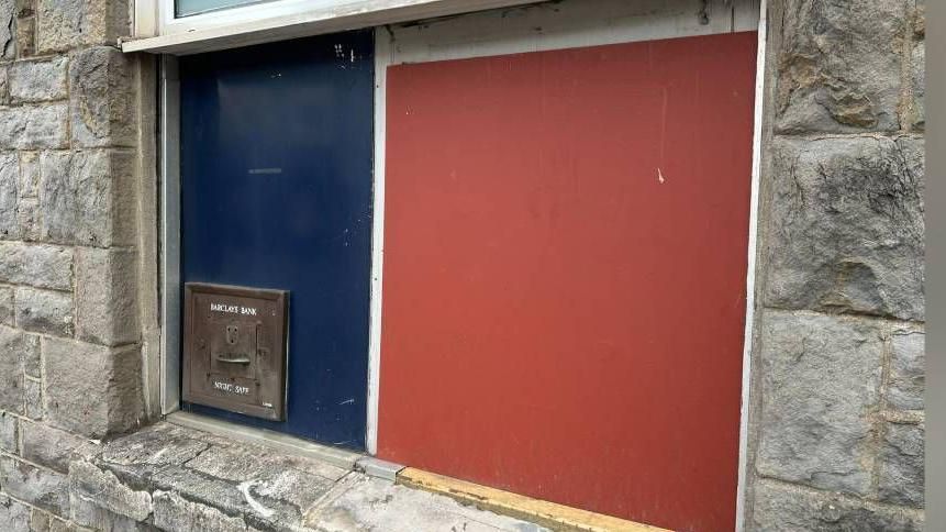 The former cash point at Barclays bank on in Treorchy, boarded up after the branch closed in April