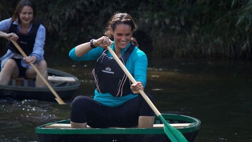 Women paddling coracles