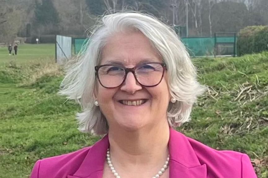 Profile picture of Edna Murphy with a green park in the background