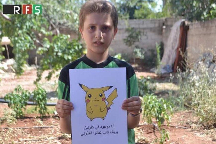 Boy holding Pokemon picture with caption asking for help