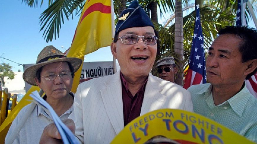 Selfdescribed freedom fighter, Ly Tong, flips through a booklet of his exploits through the decades
