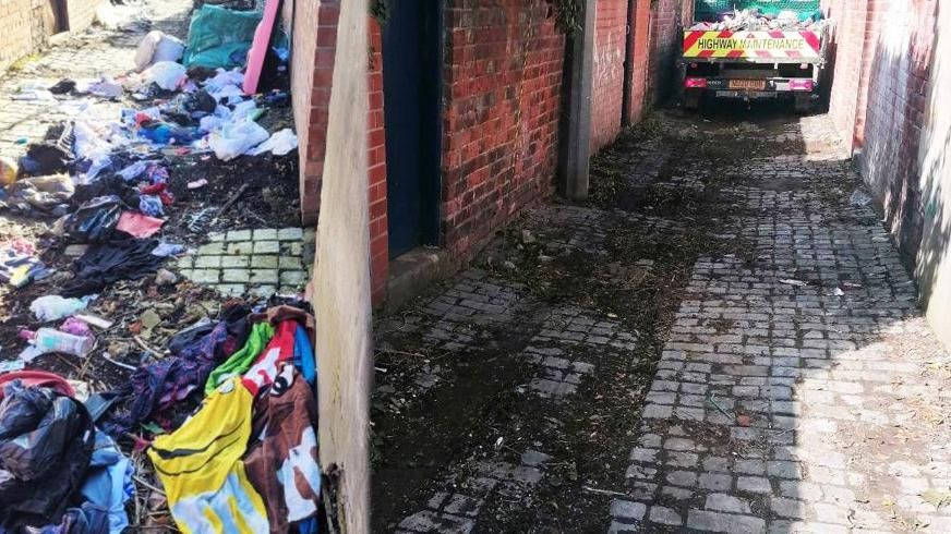 Fly-tipping in alleyway and the subsequent clean-up