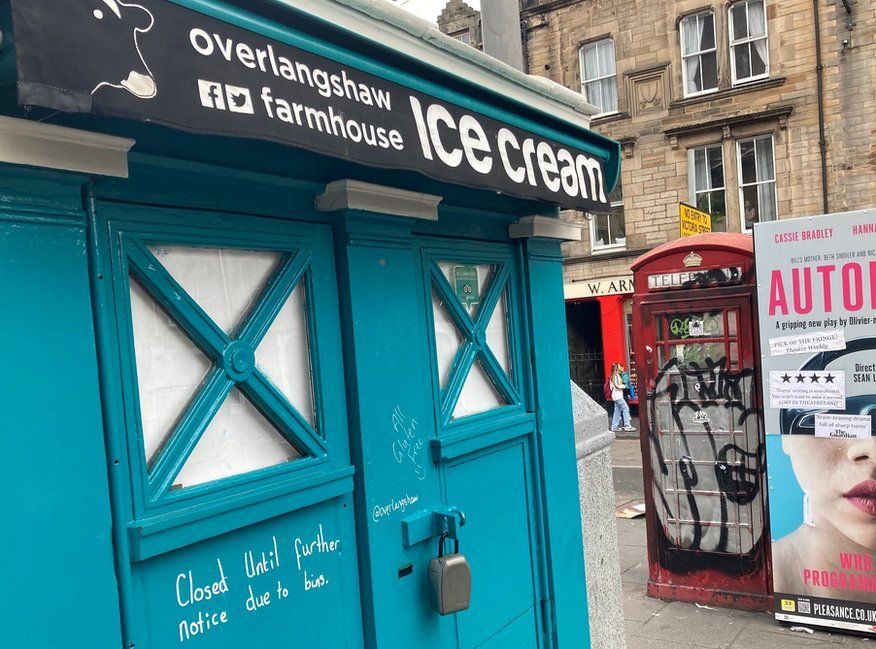 An ice cream-seller next to the biggest pile of rubbish on the Grassmarket has been forced to close