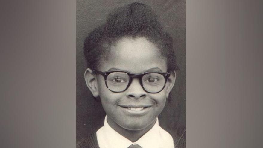 Saundra Glenn, in glasses, aged seven  