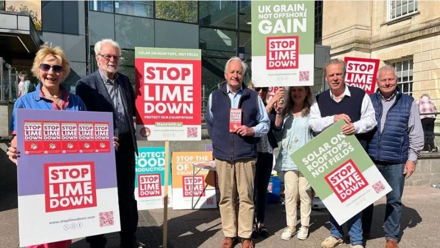 Protestors holding Stop Lime Down signs outside council HQ