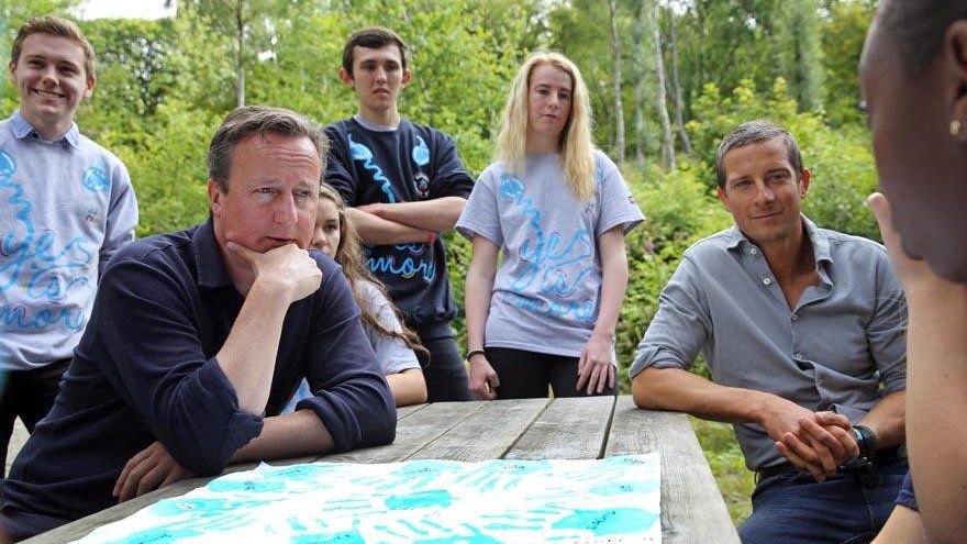 David Cameron and Bear Grylls with young volunteers