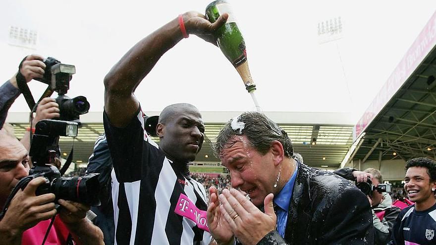 Kevin Campbell soaks West Bromwich Albion manager Bryan Robson in champagne after "The Great Escape" from relegation in 2005