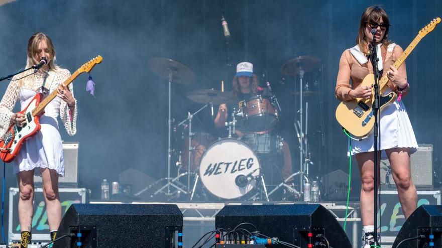 The band Wet Leg performing at a festival
