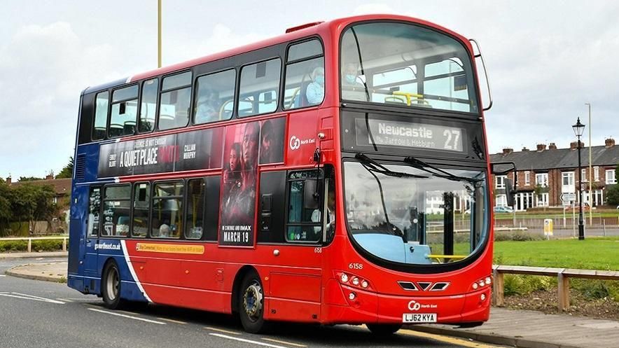 Red double decker bus with the front reading Newcastle and 27