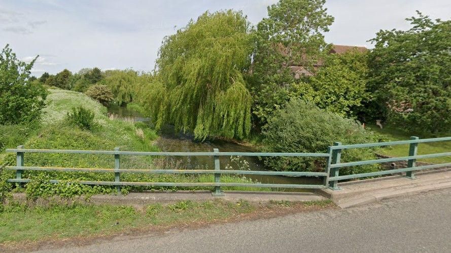 The banks of the River Witham in Claypole, with a bridge going over it