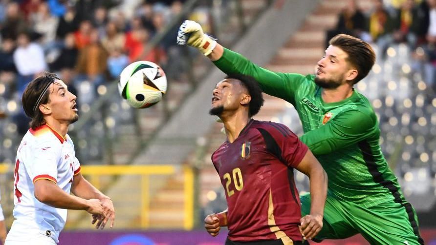 Matija Sarkic punches the ball clear against Belgium