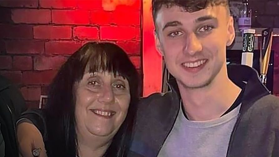 Jay Slater smiles at the camera with his arm around the shoulders of his mum, Debbie Duncan