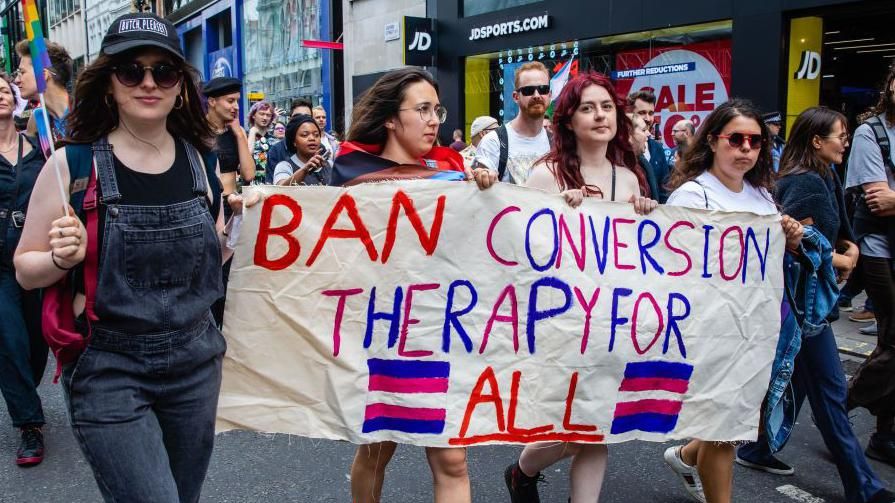 Protestors calling for a trans-inclusive conversion therapy ban