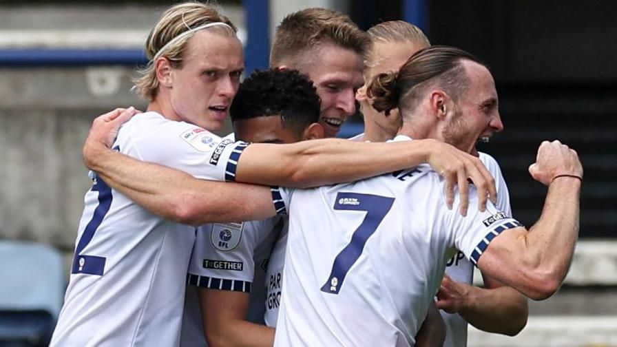 Will Keane celebrates a goal with Preston North End team-mates 