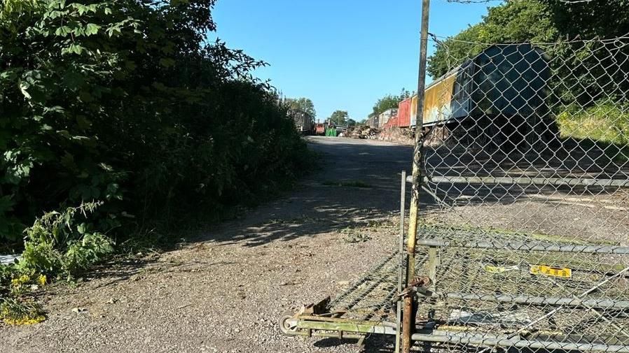 Railway yard with broken gate