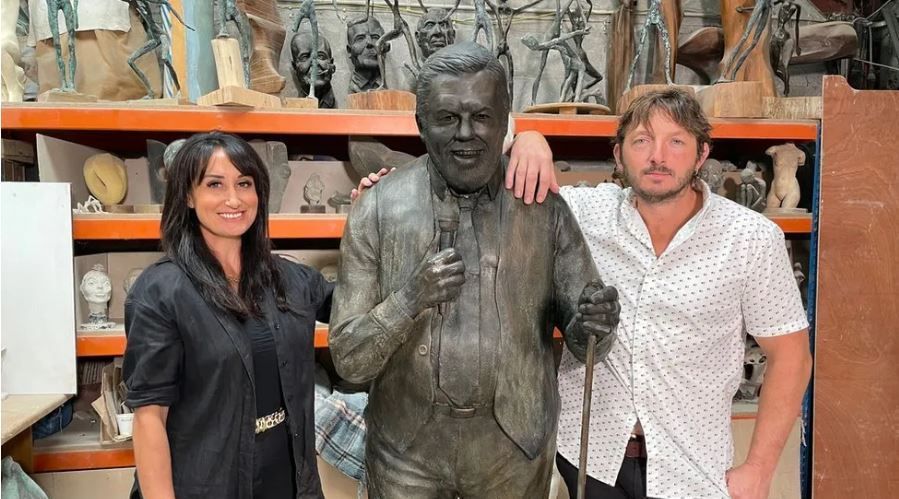 Jethro's family, including Stacey and Jesse Rowe, with the statue
