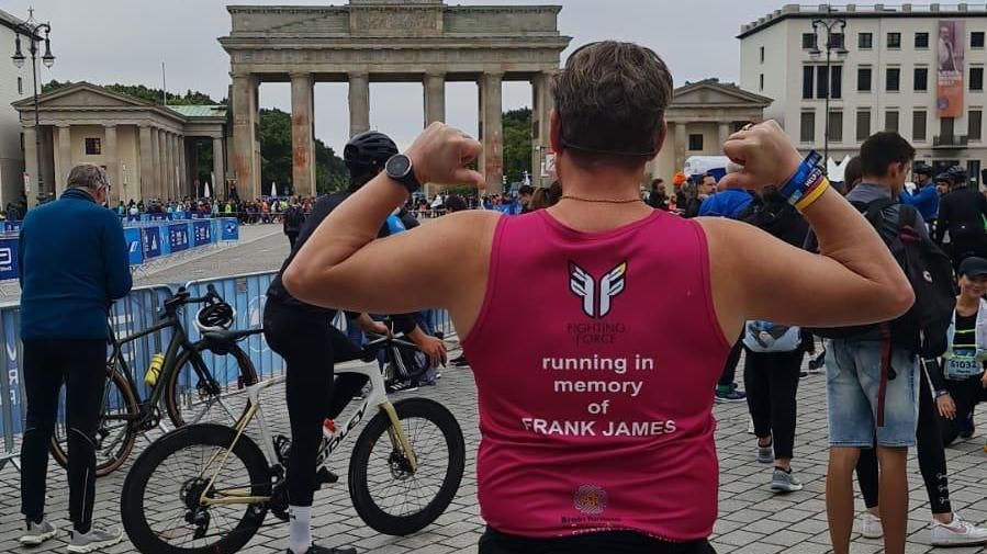 Frank Lee in a running top which reads 'running in memory of Frank James'