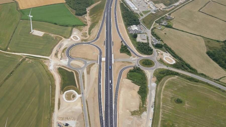 Aerial view of the dual carriageway, which shows two roads next to each other in the middle, and green fields either side