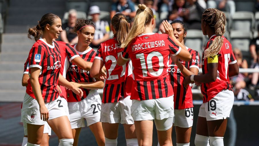 AC Milan players celebrate scoring a goal