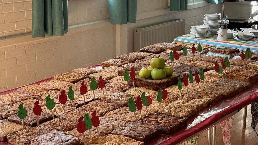 Table with dozens of square Dorset apple cakes