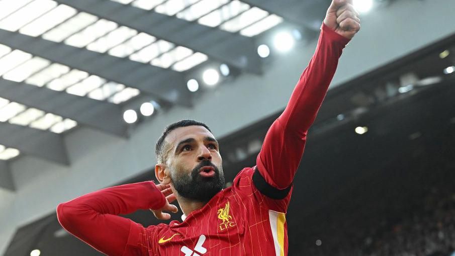 Mohamed Salah celebrates putting Liverpool ahead from the penalty spot against Chelsea at Anfield