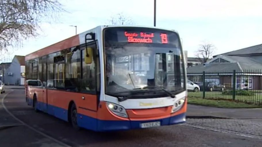 The number 19 bus driving down a road