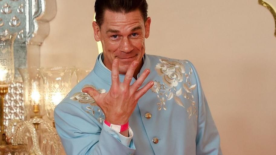 WWE legend John Cena waves to reporters