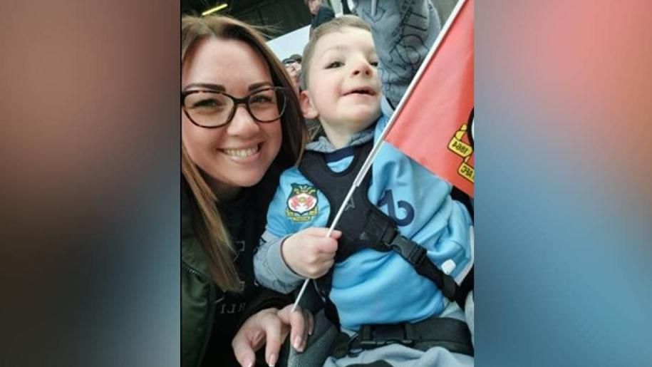 Charlotte Perrin with her son, Louis at a Wrexham FC game