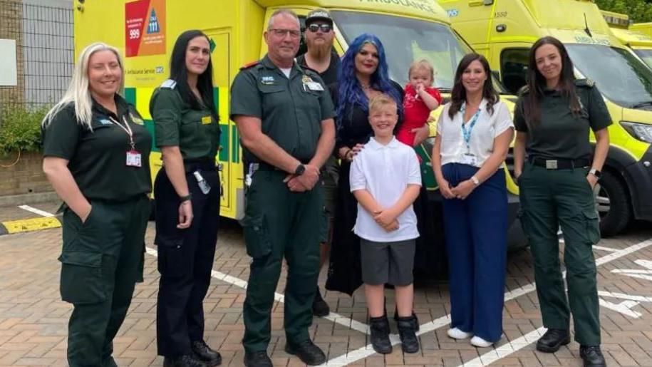 Sophie Turner (centre) and family meet ambulance crew