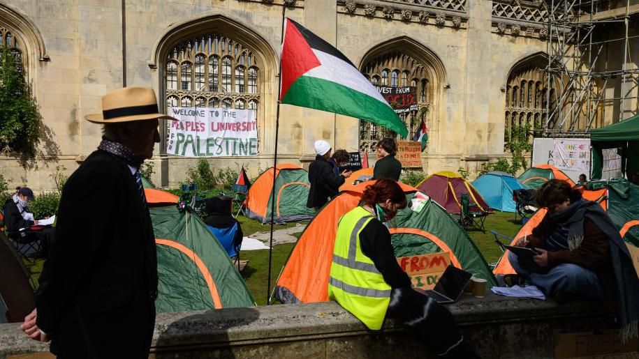 Protesters camped outside King's College in Cambridge