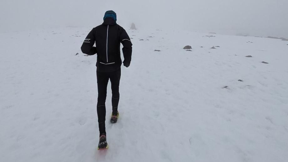 Pawel Cymbalista running on snow on Ben Nevis