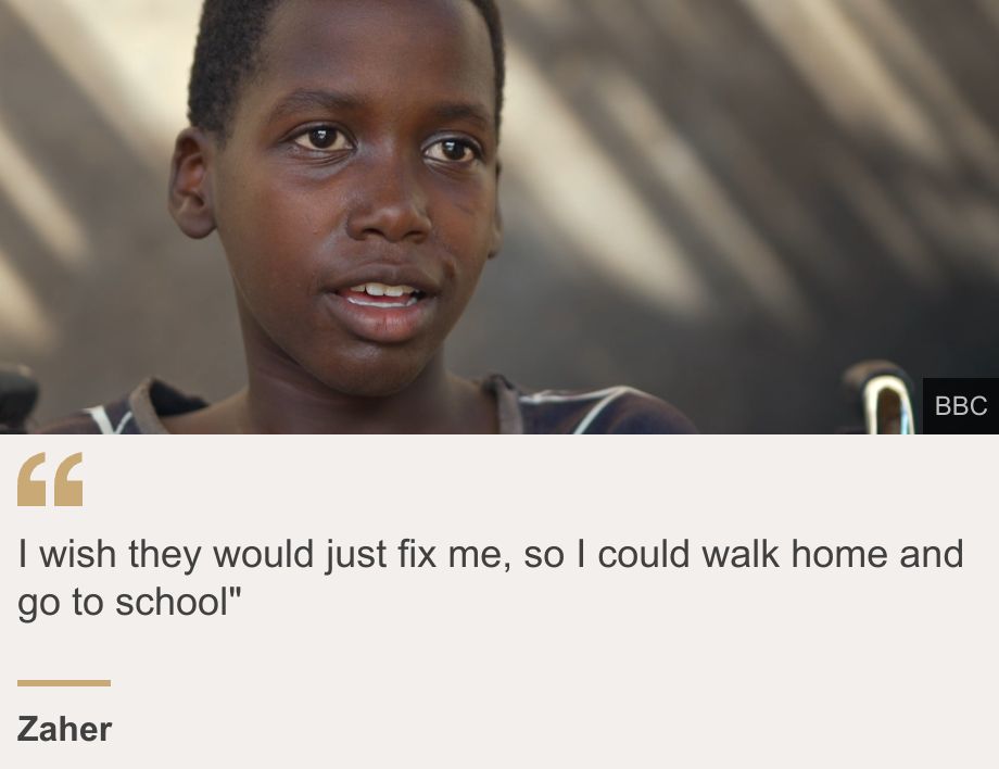 "I wish they would just fix me, so I could walk home and go to school"", Source: Zaher , Source description: , Image: A head and shoulders image of Zaher talking. One arm of this wheelchair can be seen on the right.