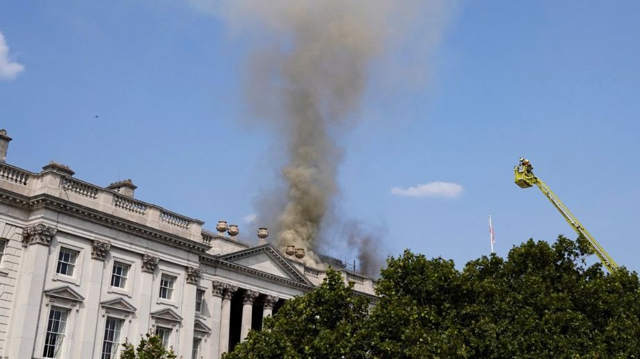 Smoke rises as firefighters work at the scene of a fire at Somerset House in London