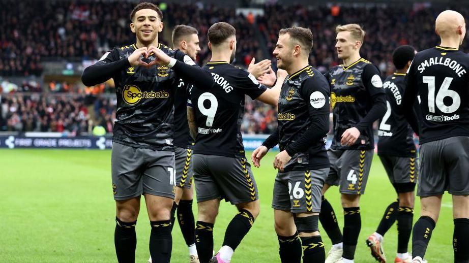 Che Adams of Southampton celebrates after opening the scoring during the Championship match between Swansea City and Southampton FC