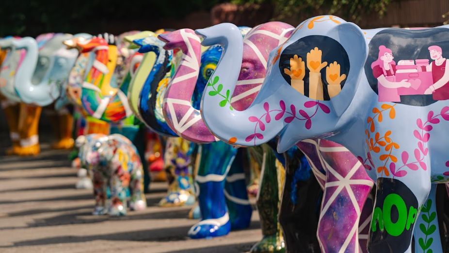 A line of painted elephant sculptures