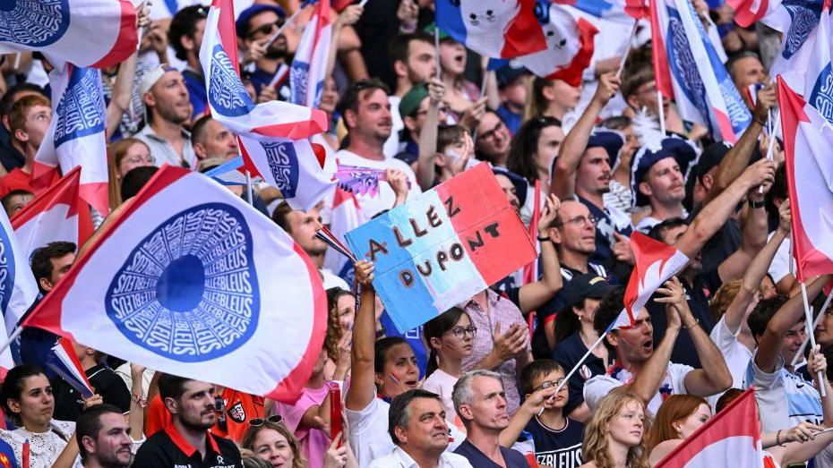 French fans celebrate their team's win against Uruguay at the 2024 Paris Olympic Games